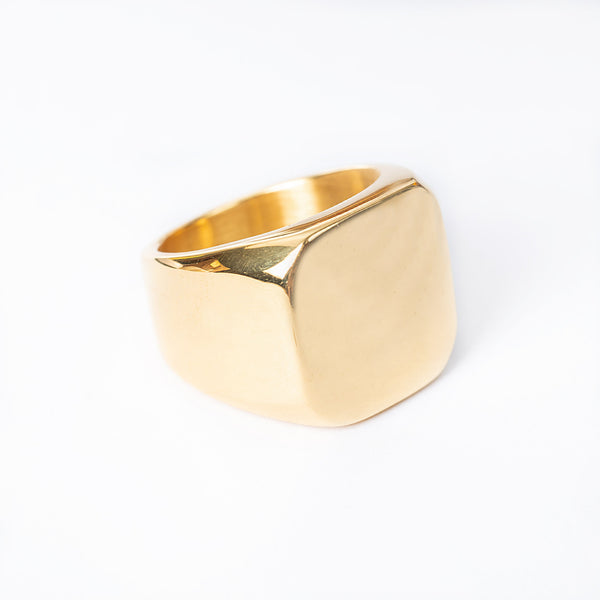 A gold-colored stainless steel Adrian ring with a polished finish