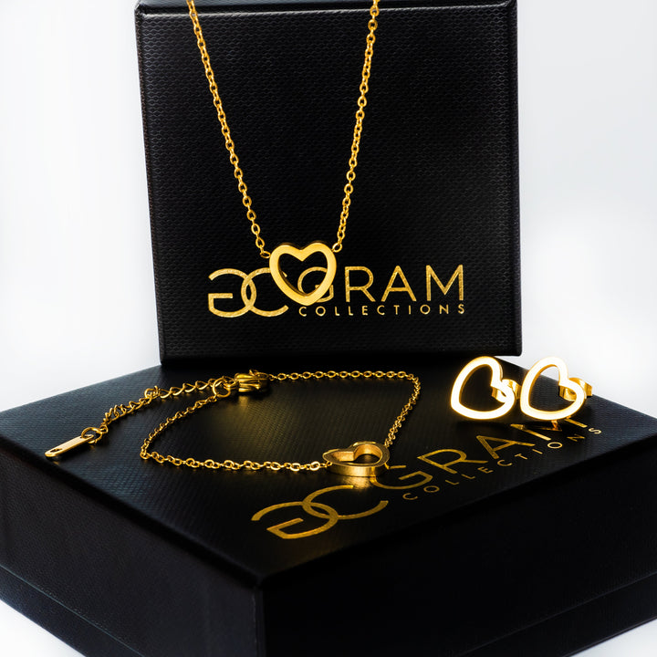 Amata Gold Jewelry set placed on its uniquely designed box, in the center of the image against a white backgrohd. 
