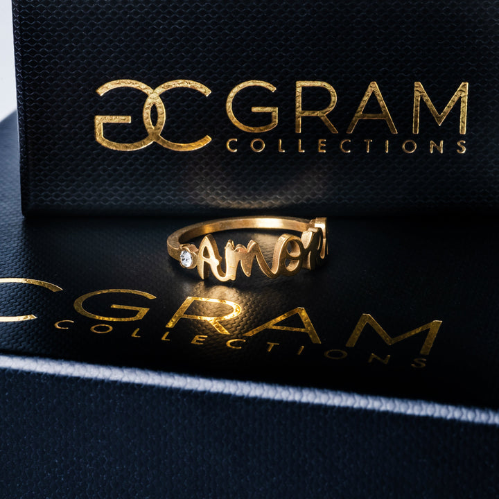 The amore ring placed o its uniquely designed black box.