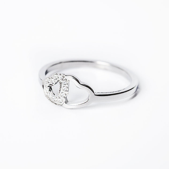 A close up view of Chloe Silver Ring standing in the center of the image against a white background. 