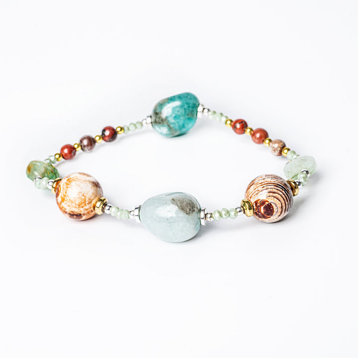 a side view of Clover Bracelet standing against a white background in the center of the image. 