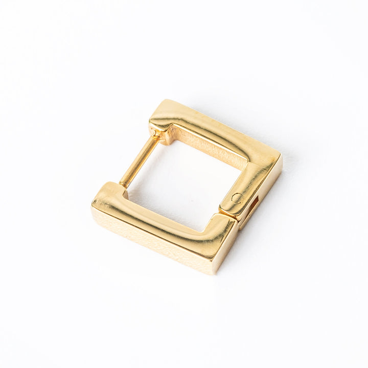 A close up view of connor earrings against a white background 
