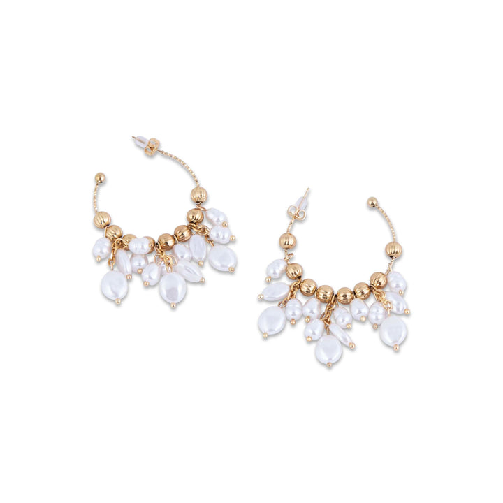 Pair of gold and pearl earrings on a white background