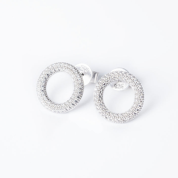 A front part view of Dalphine earrings, standing against a white background. 