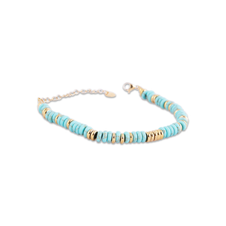 Turquoise beaded Dwejra Bracelet with gold and silver accents on a white background