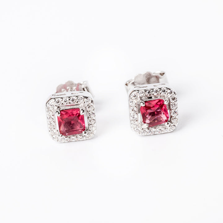 An Edith earrings in red stone colour standing against a white background. 