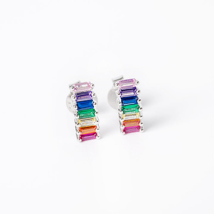 A close up view of colorful ella earrings standing against a white background in the center of the photo. 