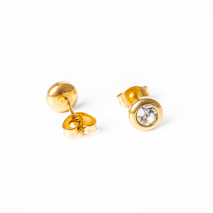 Close up view of Gabriella Gold Earrings whith white pendants 