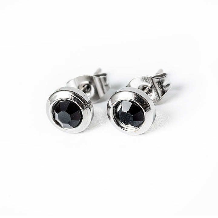 A black colour Gabriella Silver Earrings standing in the center of the image 
