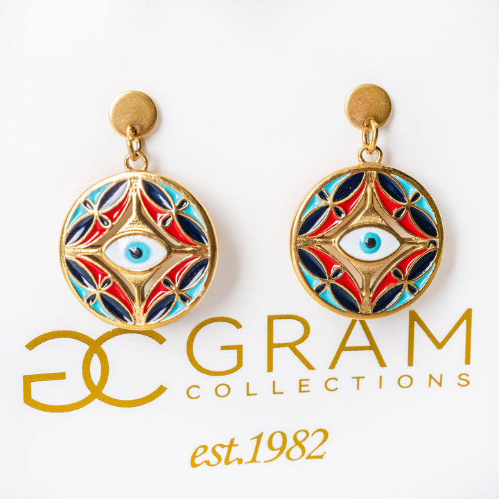Ghajn earrings attached to its box with a visible brand logo. 