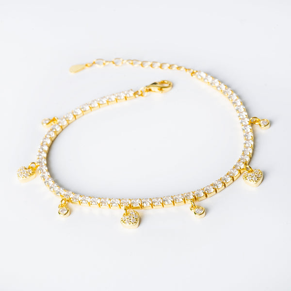 Gulia bracelet with yellow gold accents and AAA cubic zirconia beads, featuring a chain design and a lobster clasp closure.
