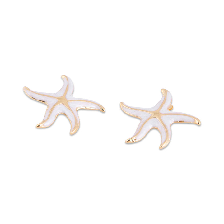 Isla Starfish-shaped earrings with gold and white finish on a white background