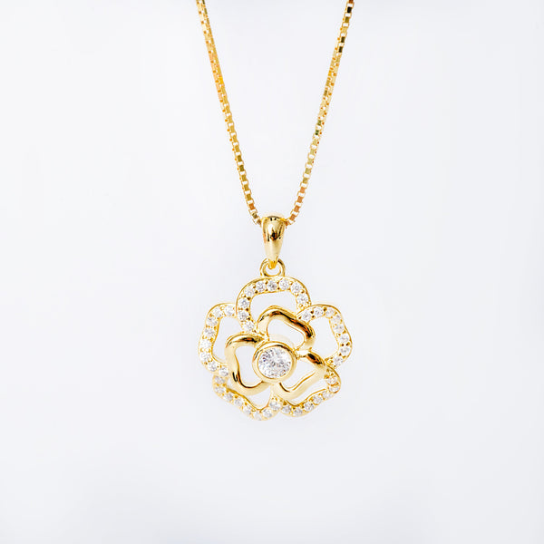 A gold-colored sterling silver Ivy necklace with a floral pendant featuring cubic zirconia, displayed against a white background.