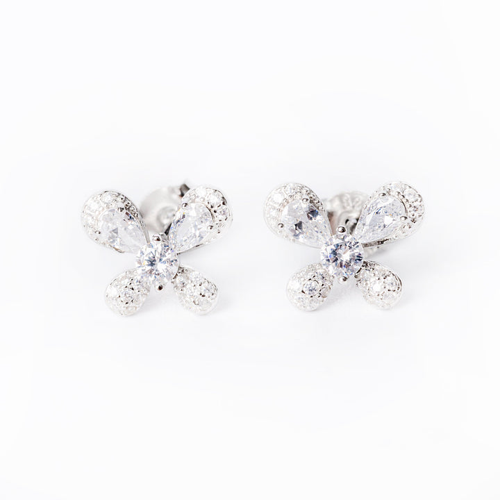 A close up of Jessie earrings standing in the center of the image against a white background. 