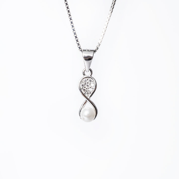 A close up view of Kaylee necklace standing against a white background. 