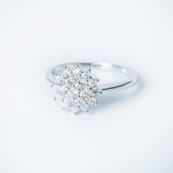 Lone ring close up view, standing in the center of the image against a white background. 