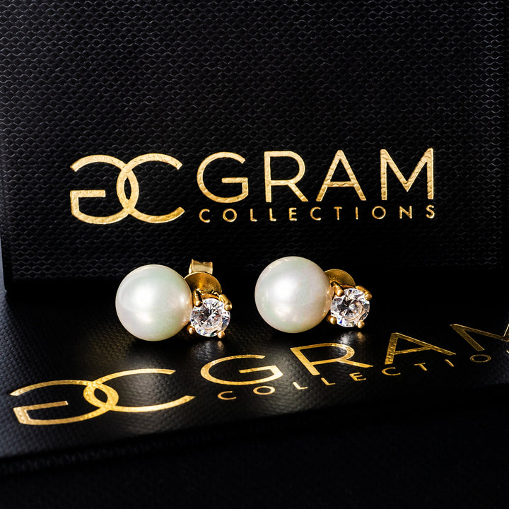 Lora earrings placed on its uniquely designed black box. 