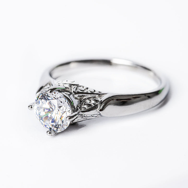 A close up view of Louise Silver Ring standing in the center of the image against a white background. 