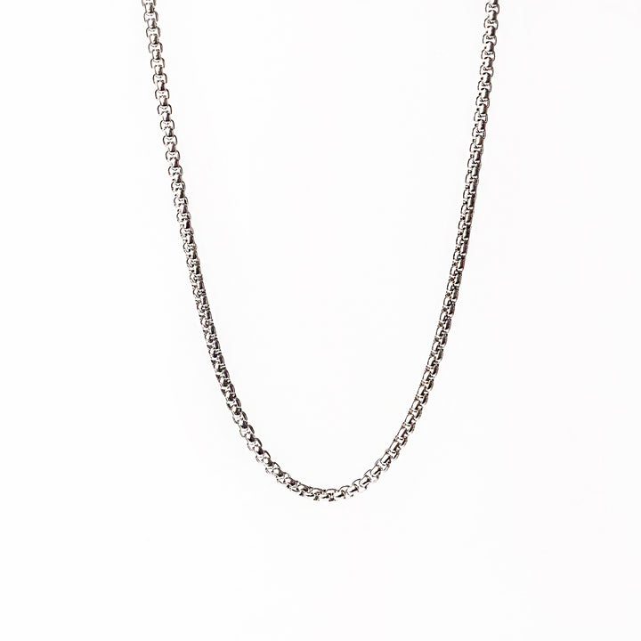 Lucca silver necklace standing in the center of the image against a white background