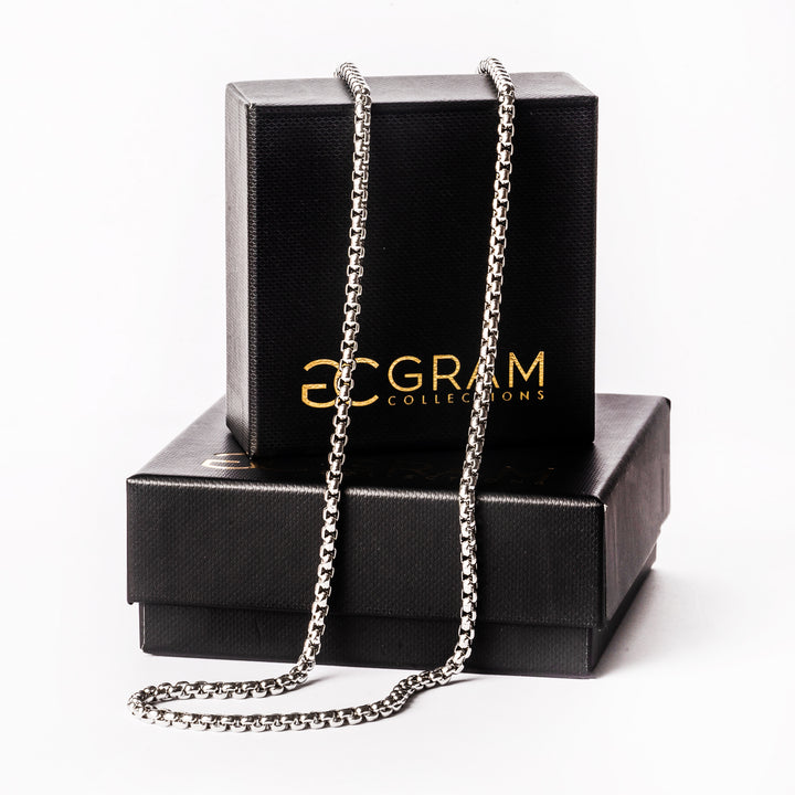 Gram collections Lucca silver necklace chain standing in the center of the image. 
