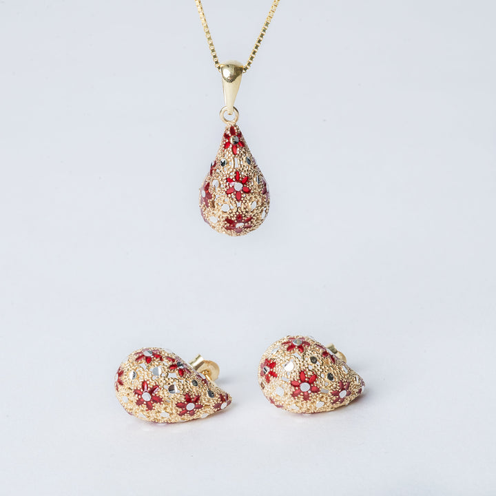 A close up of Lucija Earrings, one standing on in the top attached to its chain, another two placed on a. ground. 