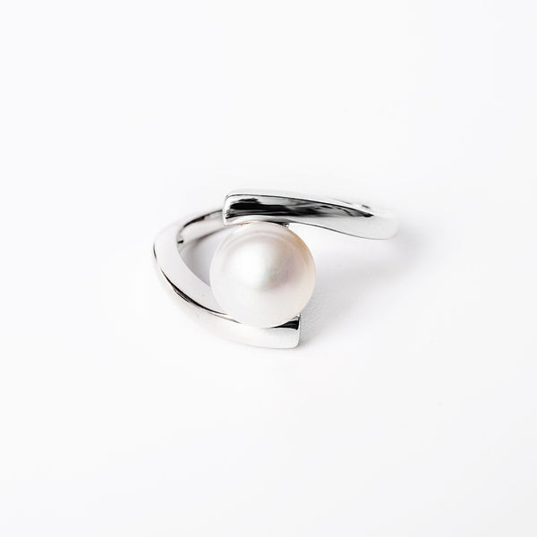 A close up view of Luella Ring standing in the center of the image against a white background. 