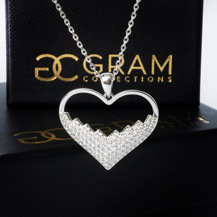 Gram collections lyn necklace standing against its box in the background 