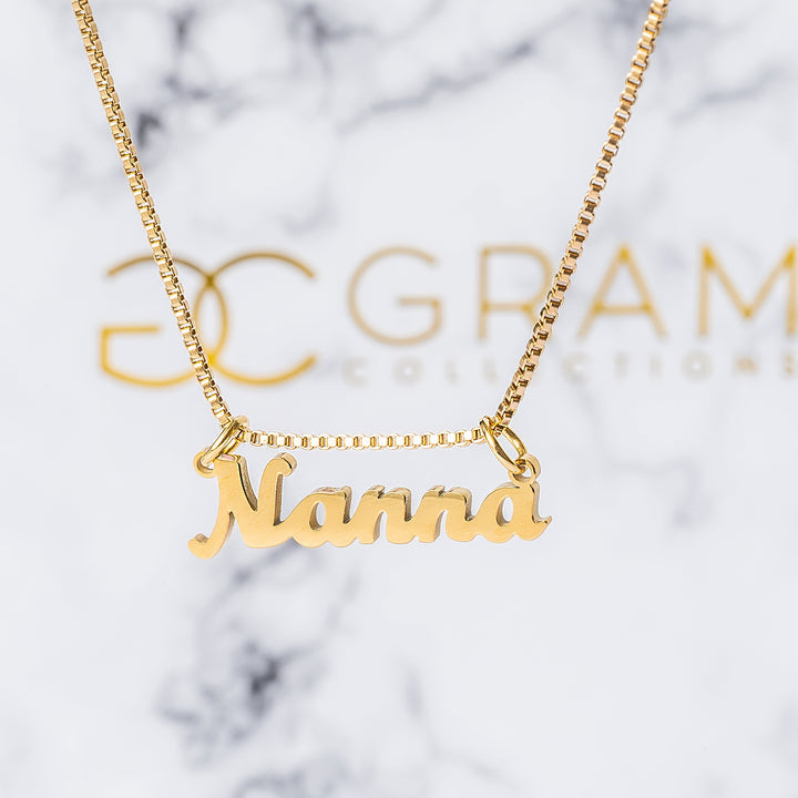 Gram Collections Mahbuba Nanna Necklace in front of its uniquely designed box. 