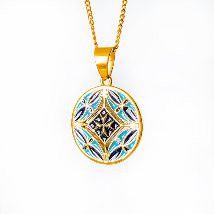 Malta gold necklace with a decorative pendant on a white background