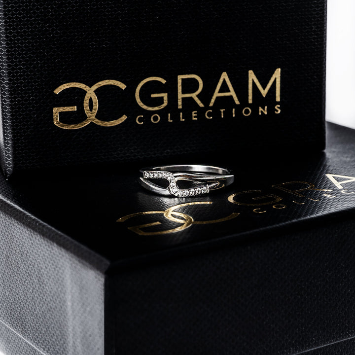 Marianne silver ring placed on its box in the center of the image. 
