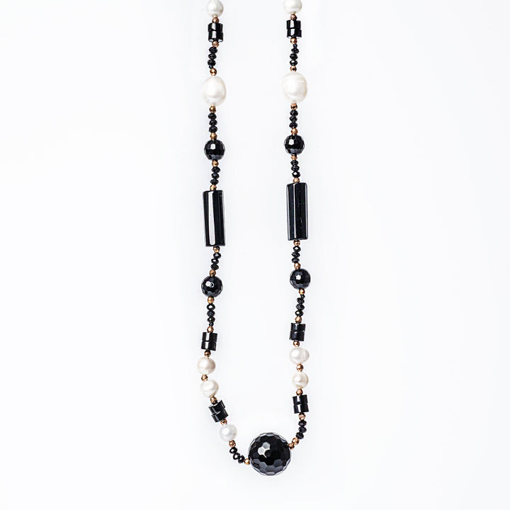 A close up view of MoonLight Necklace standing in the center of the image 