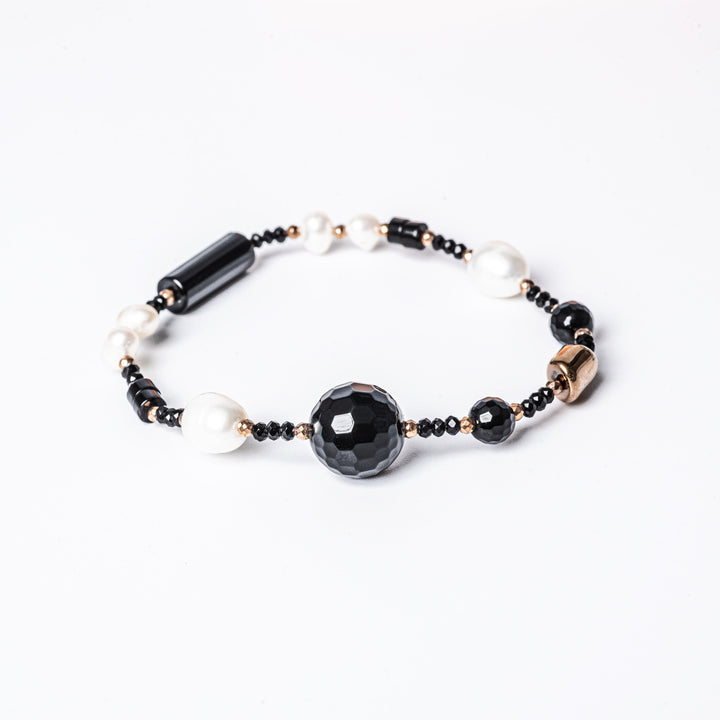 A close up view of MoonLight Bracelet standing in the center of the image against a white background 