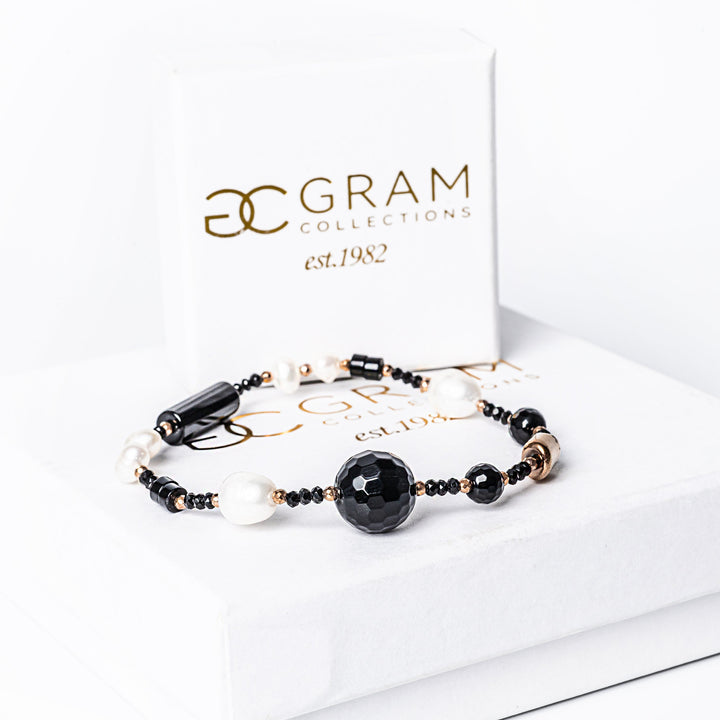 MoonLight Bracelet placed on its box, standing in the center of the image 