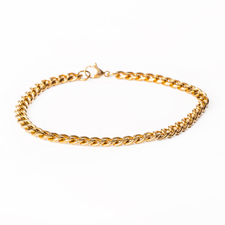 A yellow gold stainless steel bracelet with an adjustable clasp, displayed on a white background.