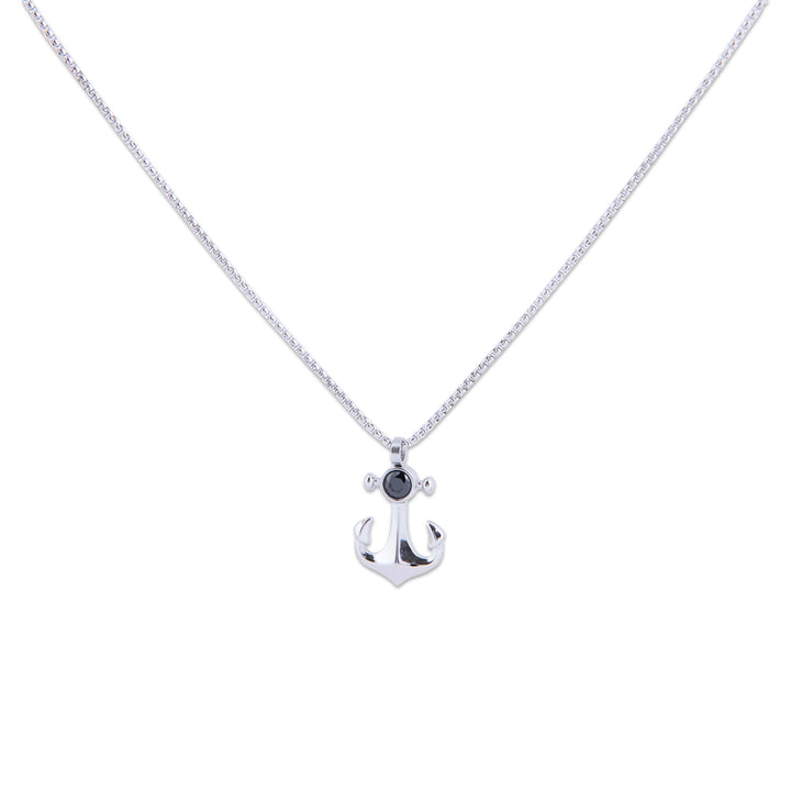 Qawra Necklace with a black gemstone on a white background
