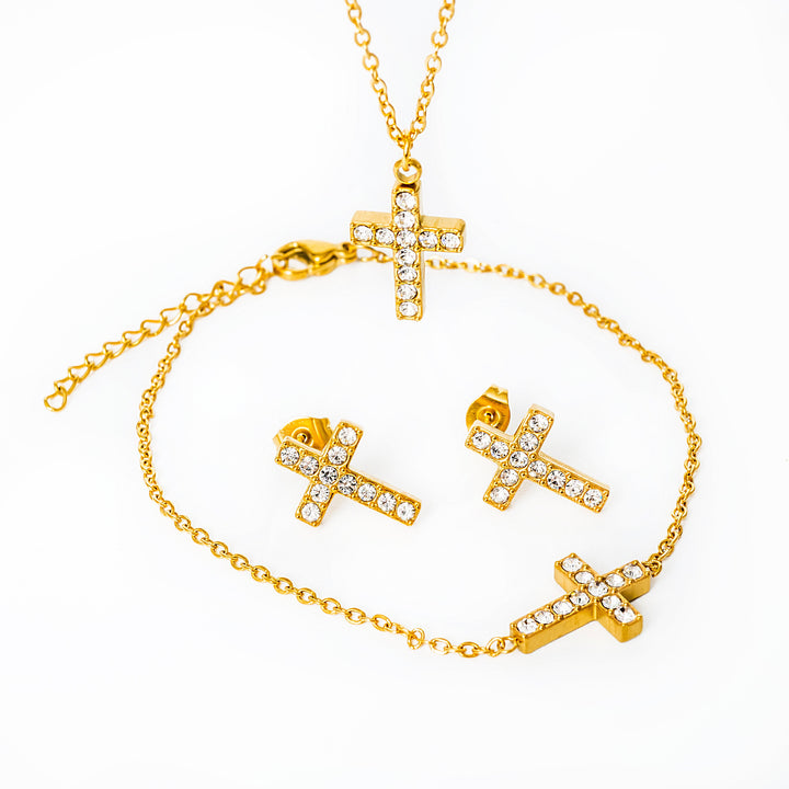 A close up view of cross shaped Raisa set consist of necklace and bracelet, placed in the center of the image against a white background. 