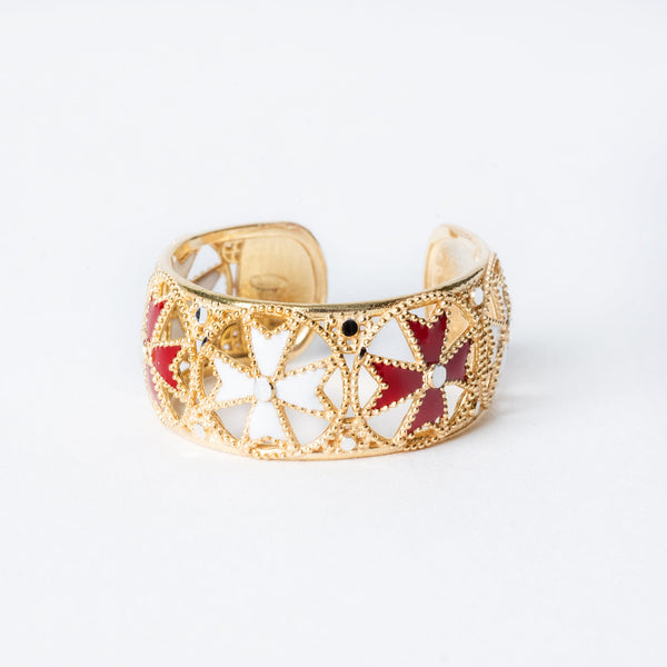 A sterling silver Rita ring with yellow gold plating and red and white enamel detailing in a floral pattern.