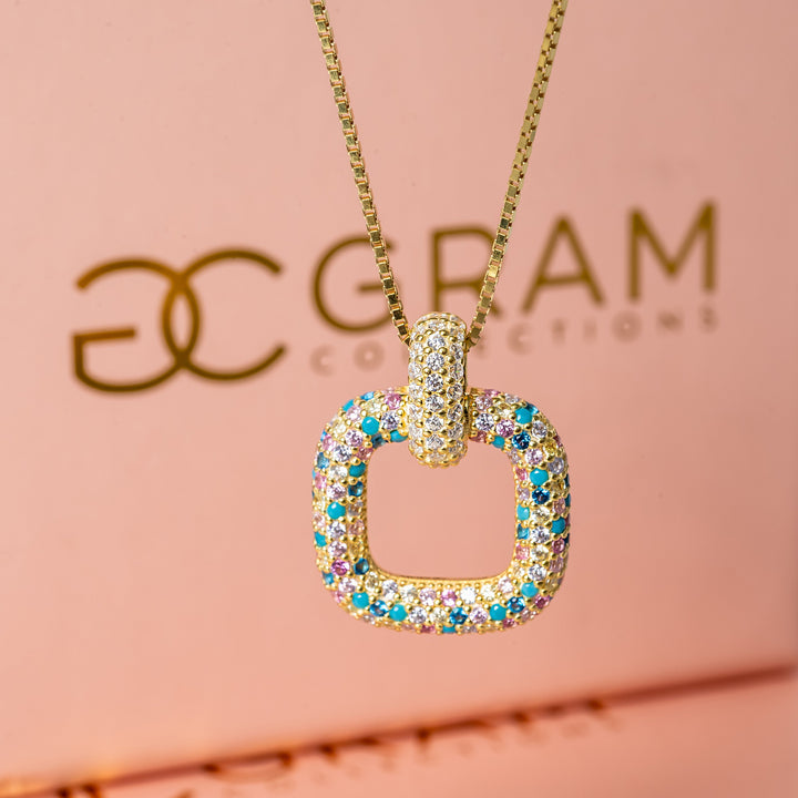 RoseMarie Necklace standing in the center of the image against its uniquely designed box.