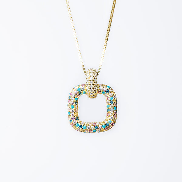 A sterling silver 925 RoseMarie necklace with a yellow gold finish, featuring a pendant with blue and multicolored cubic zirconia stones.