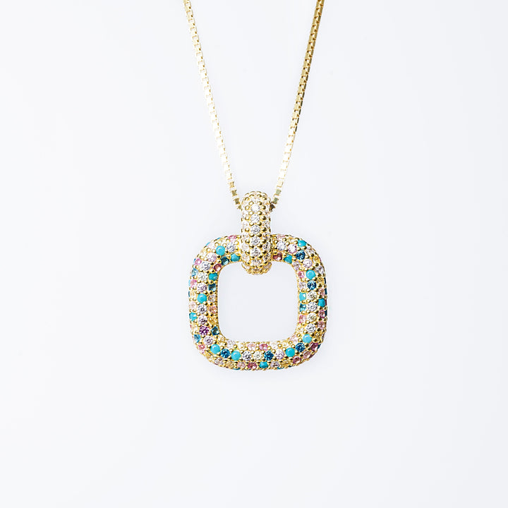 A sterling silver 925 RoseMarie necklace with a yellow gold finish, featuring a pendant with blue and multicolored cubic zirconia stones.