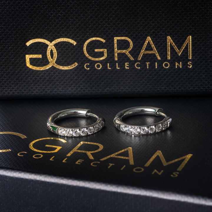 Sharm Silver Earrings placed on its box. 