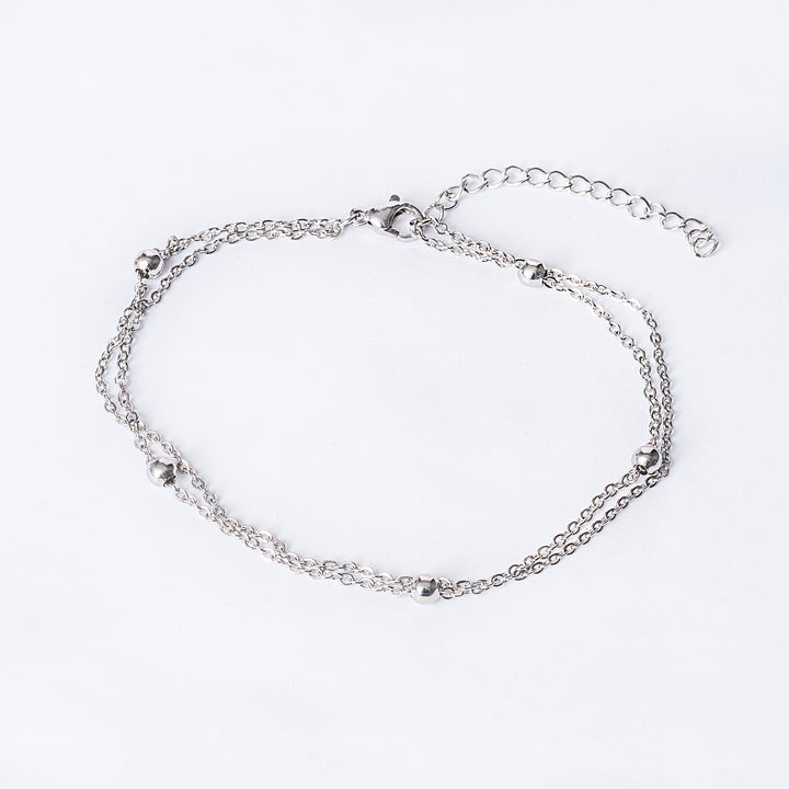 Silver anklet on a white background