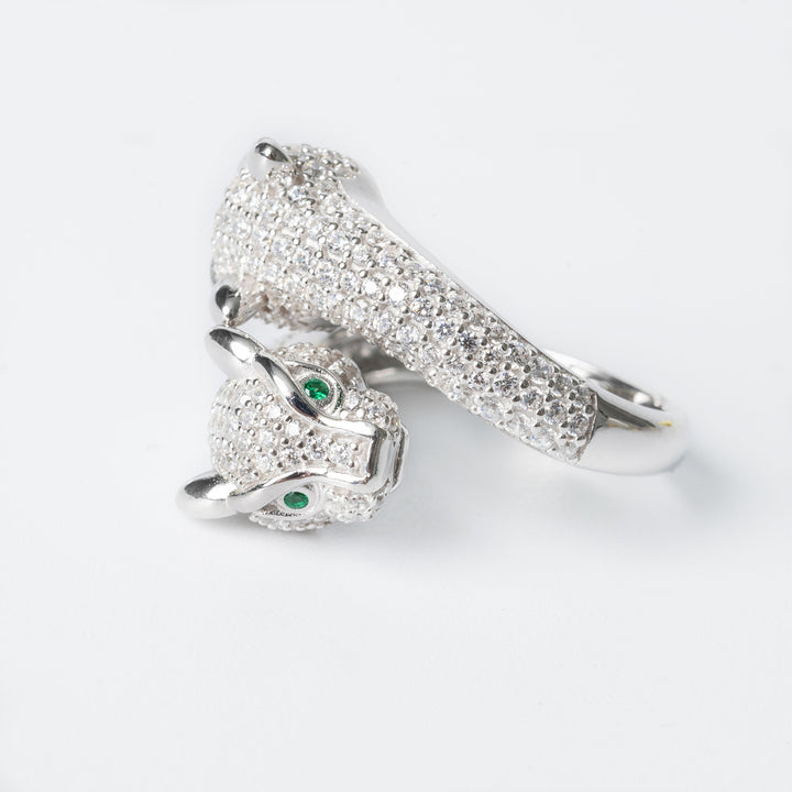 A close up of Sophie Ring placed on a side, with a tiger face, standing against a white background. 