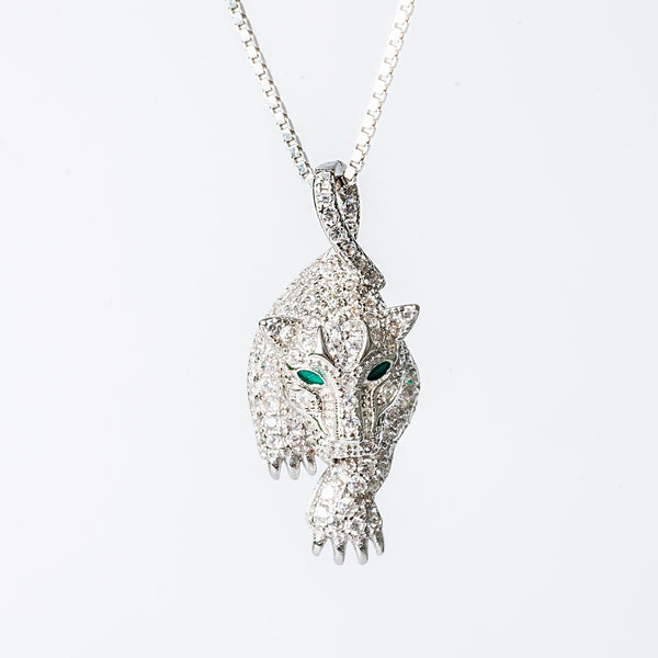 A Sophie necklace featuring a hypoallergenic and tarnish-free design, with a pendant in the shape of an animal's head adorned with cubic zirconia.
