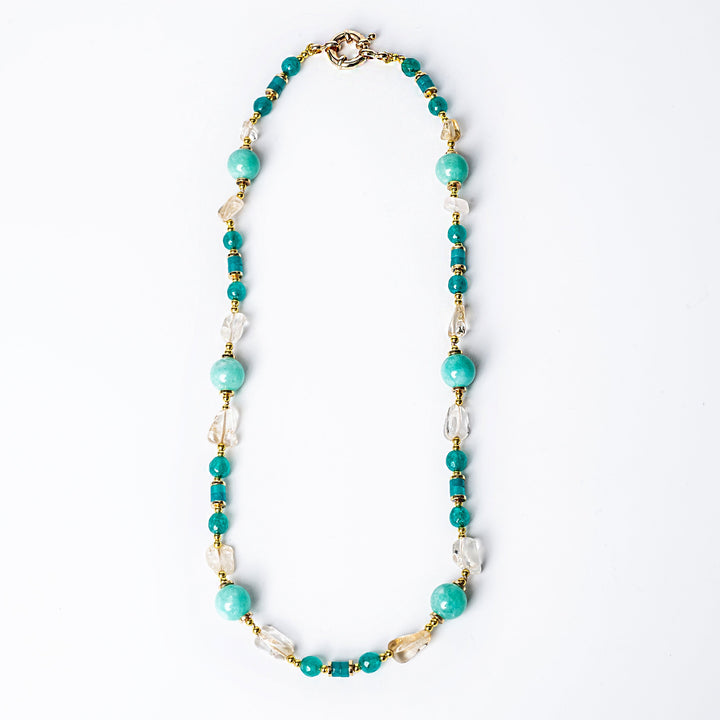 A spring necklace bird view, placed in the center of the image against a white background. 