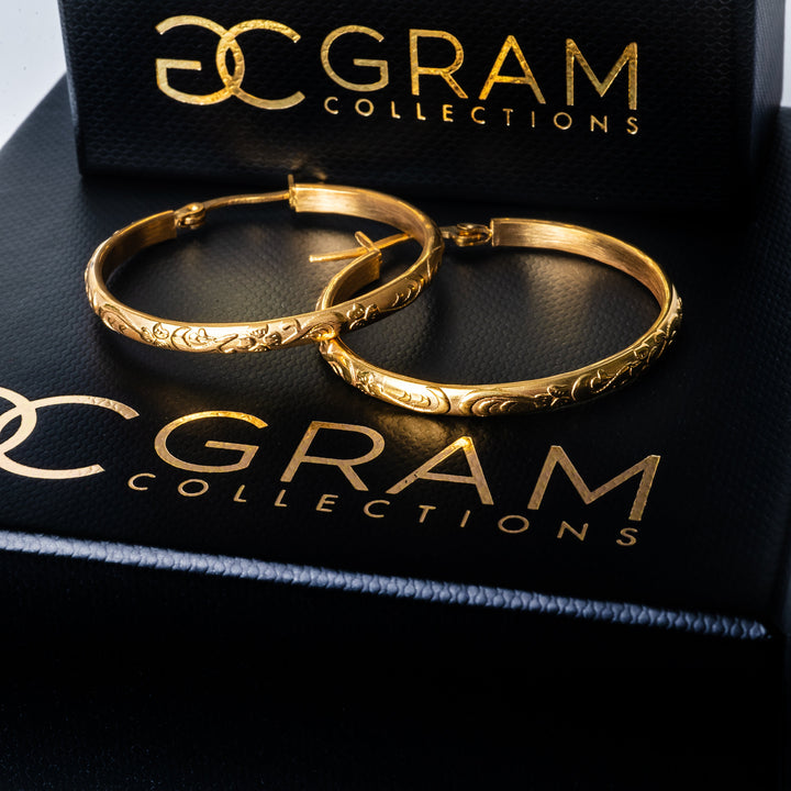 Gram Collections Sue earrings standing in horizontal position on top of each other against each other. 