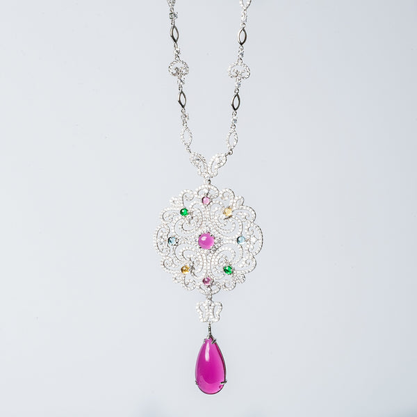 Taryn necklace with a floral pattern, featuring multicolored cubic zirconia stones and a single pearl-like bead.