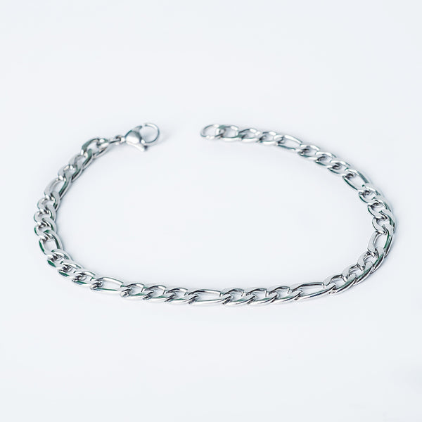 Tropea Bracelet in silver featuring a polished Figaro chain on a white background