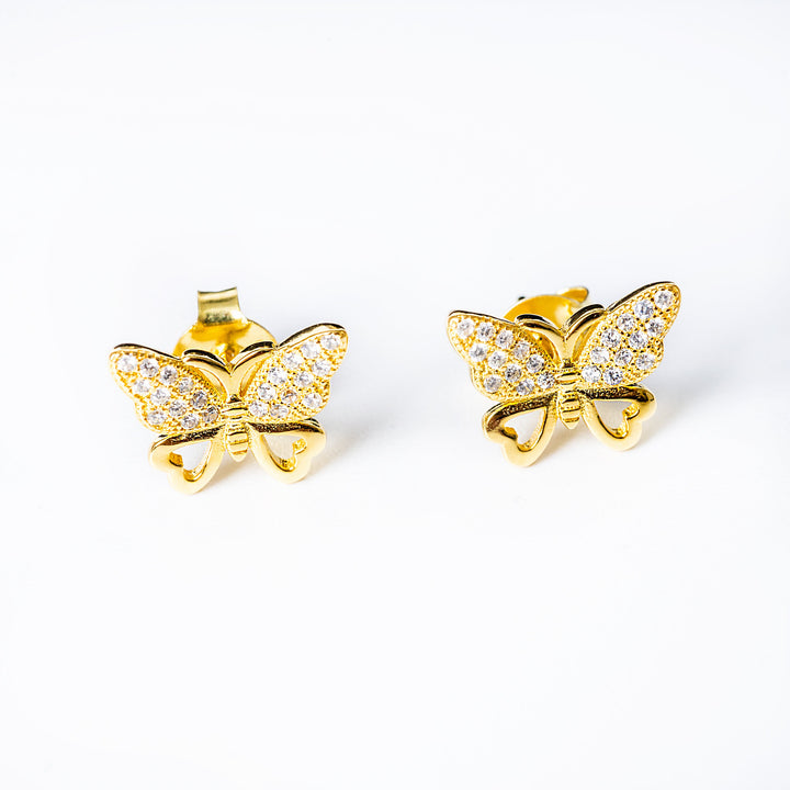 A close up view of Zoe earrings standing against a white background. 