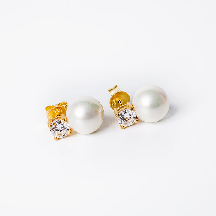 A close up view of Lora earrings standing in the center of the image against a white background. 